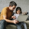Father and daughter using computer